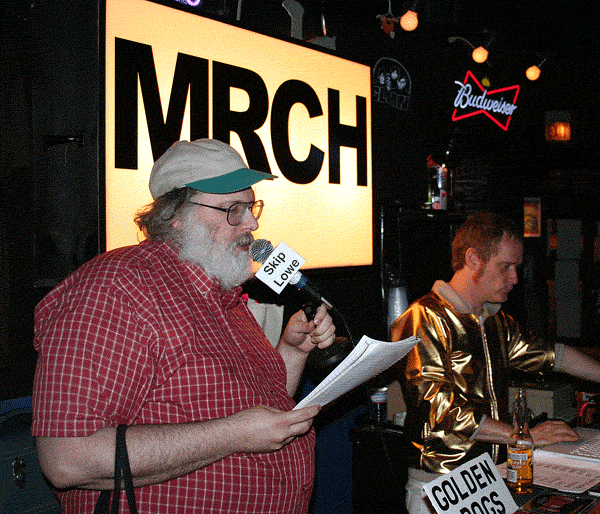 Thax Douglas reads a poem from the \"MRCH Broadcast Booth.