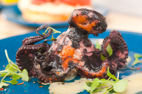 Octopus a la plancha - with black pepper, preserved lemon, olive oil, and chilis.