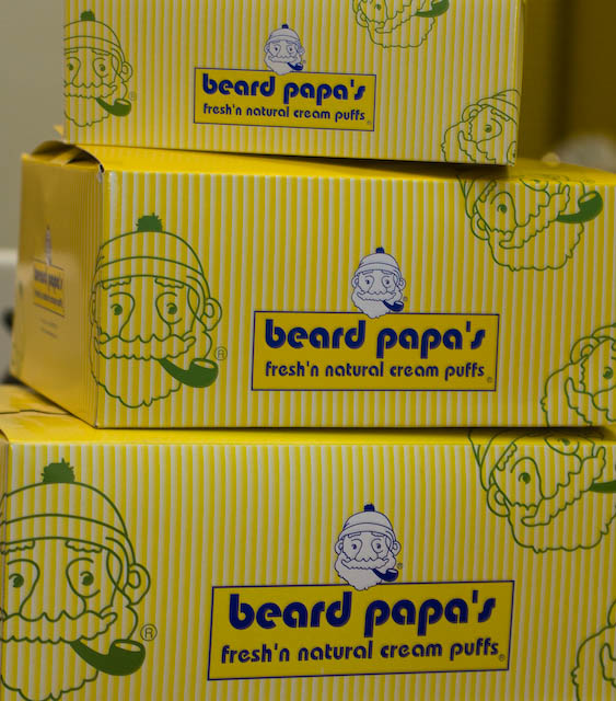 The Beard Papa\'s box with Beard Papa himself and his pipe.