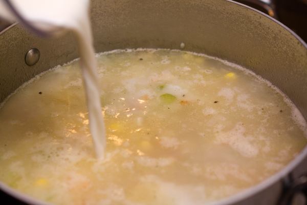 Add the 1/2 cup of milk or cream.  We used whole milk.  Gently heat the soup for about another minute (don\'t let it boil again - you just want to make sure it\'s hot).