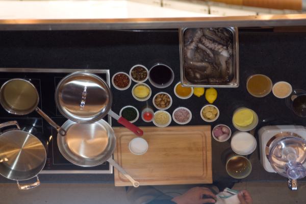 A shot of the mirror over the counter for Chef Jose Garces (of Mercat a la Planxa).  Octopus and spices!