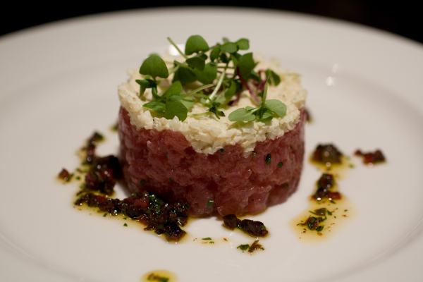 Tuna - yellowfin tuna tartare, celery root remoulade, moroccan cured olives, virgin olive oil (from MK).  Tartare is a preparation of seasoned, finely chopped raw fish or raw beef.