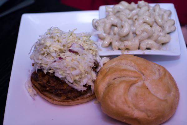 Manila pulled pork Adobo braised pork shoulder and miso lychee coleslaw on a toasted bun.  Side of Cheddar Mac and Cheese.