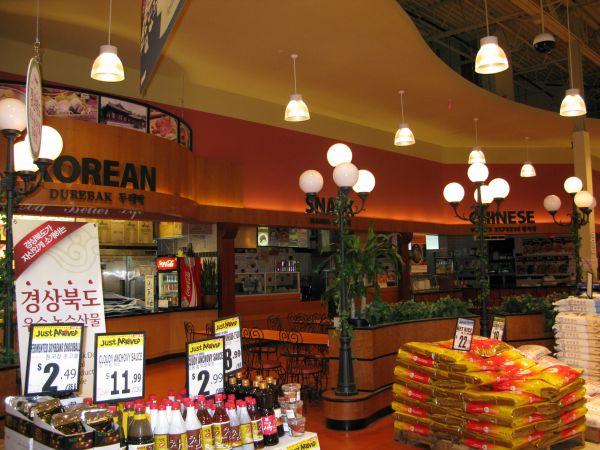 On one side of the large grocery, you\'ll find Korean, Chinese and Japanese (not pictured) food.  Sit down and take a break from your shopping adventure.