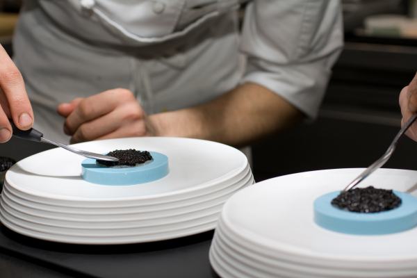 Fluke caviar is carefully placed before the ring mold is removed.