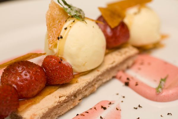 Strawberry Row:  Whipped strawberries, dense strawberry torte, reisling-roasted market strawberries, licorice-scented ice cream, grated licorice root extract, ginger pastry crisps, crystalized tarragon