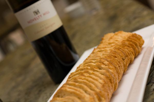 A bottle of red wine and a thinly sliced baguette accompanied our charcuterie plate.