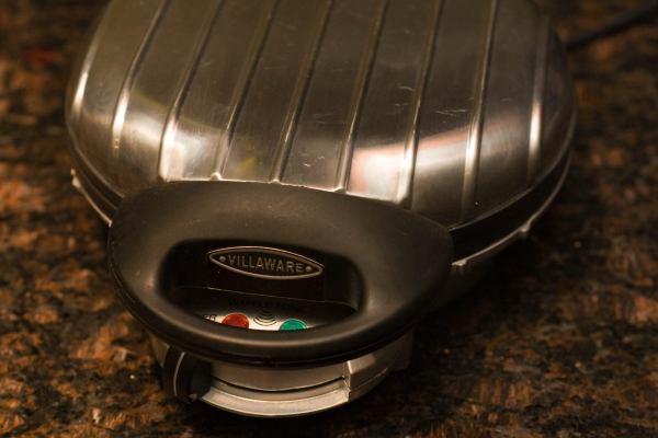 Here\'s our waffle maker.  It makes mini Belgian waffles.  We were a little concerned that the wells were too deep for this experiment but we didn\'t let that stop us.  We put the heat setting on 4 of 7.
