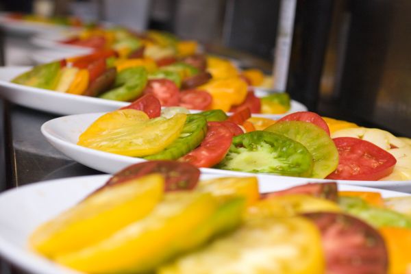 The colorful, sliced Heirlooms waiting to be dressed in the kitchen.