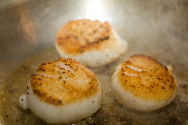 (Step 1 begins with picture 2) Step 5: Flip your scallops.  Here you can see the nice sear we\'ve made.  Once flipped, these can continue for another minute or so.  Continue to picture 8 for a close up of the final product.