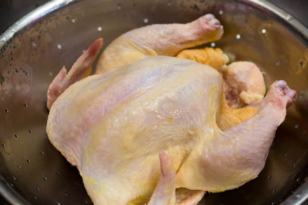 Rinse the chicken with cold water.