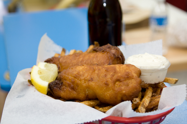 Fish and chips, slices of lemon, a generous serving of tartar sauce and, of course, malt vinegar.