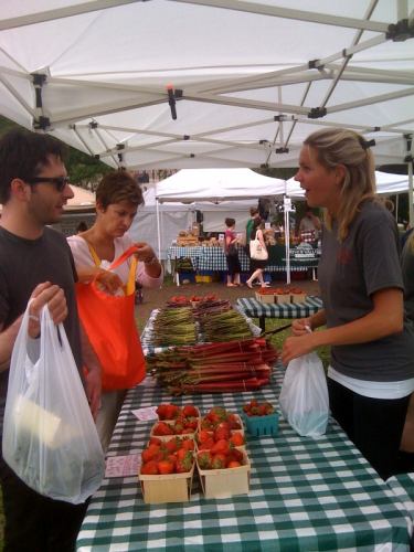 Chef Galzin checks out fresh Michigan strawberries and rhubarb at the Green City Market.