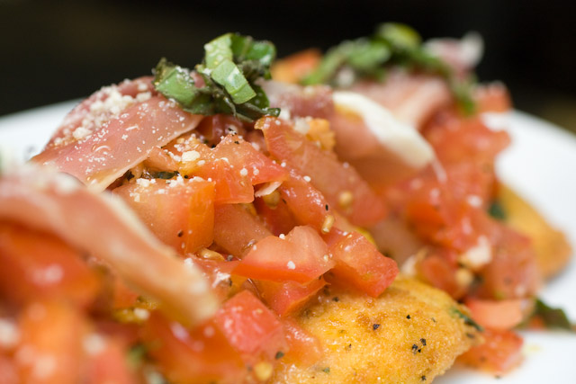 Fromage Fritti $10.00 -\r\nFresh Mozzarella pan fried to perfection topped with Garlic, fresh Basil and diced Plum Tomatoes finished with thinly sliced Prosciutto