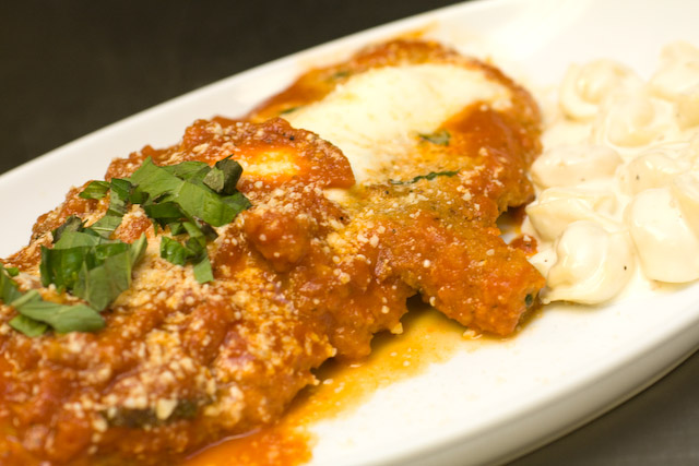 Pork Chop Parmesan $28.00\r\nPounded thin and lightly breaded with Fresh Mozzarella and San\r\nMarzano Tomato Basil Sauce