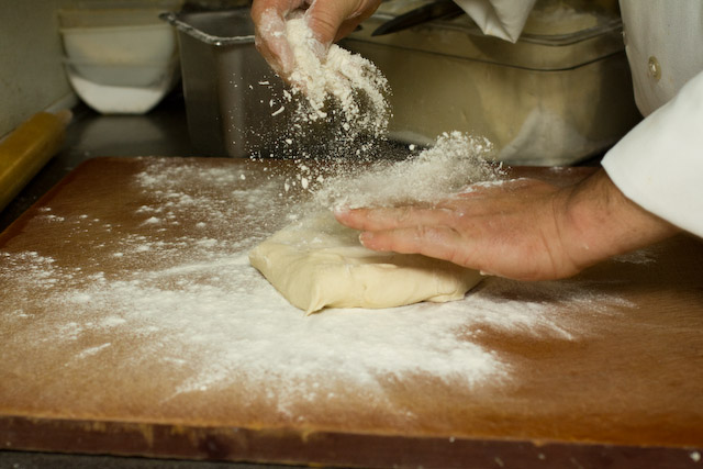 Chef Perdue begins with flouring the board and the pasta dough.