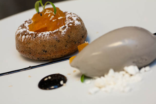 Black sesame financier with compressed persimmons and black sesame ice cream. Dessert available at Shanghai Terrace.