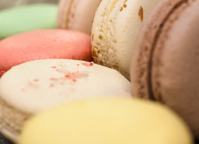 Assorted macarons in Pierrot Gourmet: pistachio, chocolate, salted caramel, chocolate candy cane, egg nog, nutella, and raspberry.