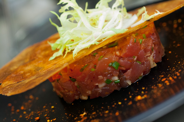 Tuna tartare franÃ§aise with espelette pepper and potato crisp.