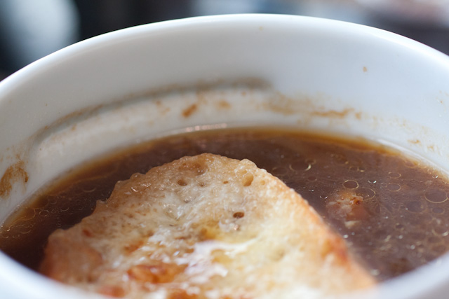 French Onion Soup. What makes this particularly delicious is that it is not overly salty and is not covered in a mound of cheese. Restraint makes this bowl of soup perfect.