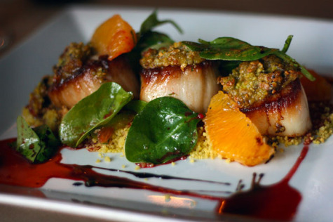 Smoked day boat Scallops, pistachio crust, curried cous cous, blood orange brown butter sauce