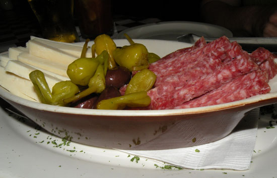 To tie us over until the procession passed we ordered some appetizers. Here is a salami and provolone antipasto dish.