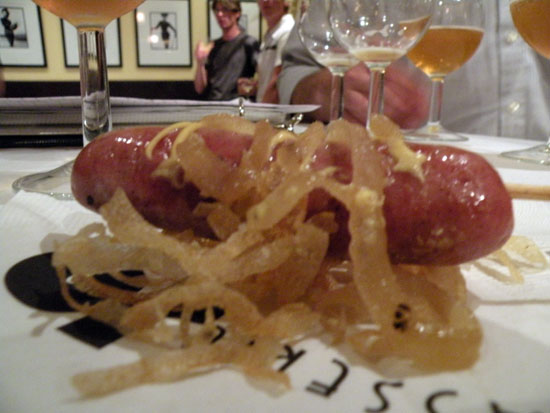 Mini Sheboygan bratwurst poached in beer and served with both caramelized and crispy onions.