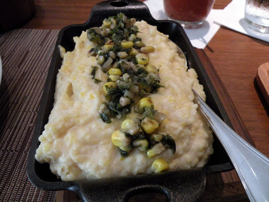 C-House\'s grits ($5) are made with aged mild cheddar and topped with roasted corn and pickled ramp vinaigrette.