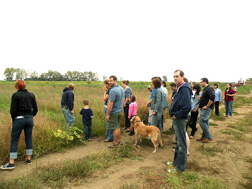 The assembled guests stop in front of Westerhoff\'s pumpkin patch.