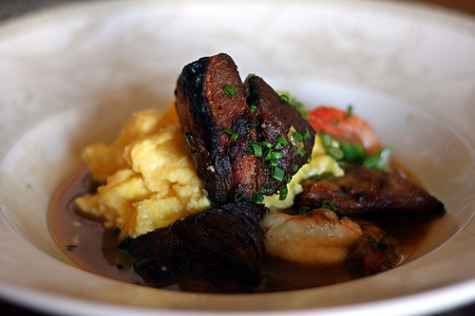 Pork confit with andouille and shrimp stew, and scrambled eggs