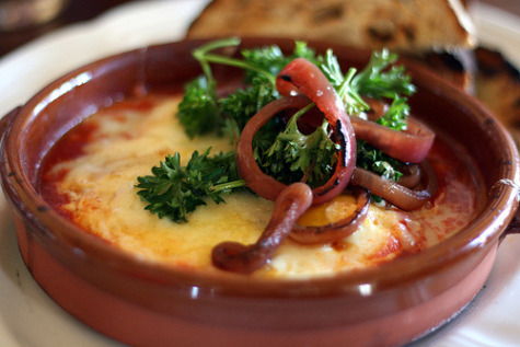 Wood-fired egg with harissa, gouda and grilled bread.