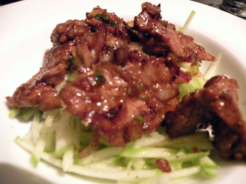 Beef with lemongrass salad.  The base of the salad is the julienned apple salad which is also an option on the menu.