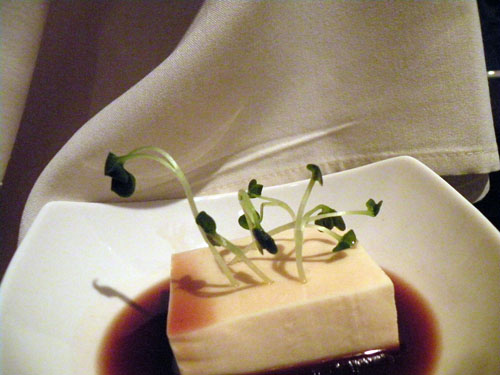 Cold Japanese tofu, with micro watercress greens in a pool of red wine and soy sauce.