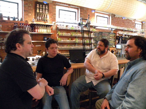 Kahan, McAvena, John Barbaras of Paramount Merchants, and Bueltmann have a moment of chit-chat before brewing.