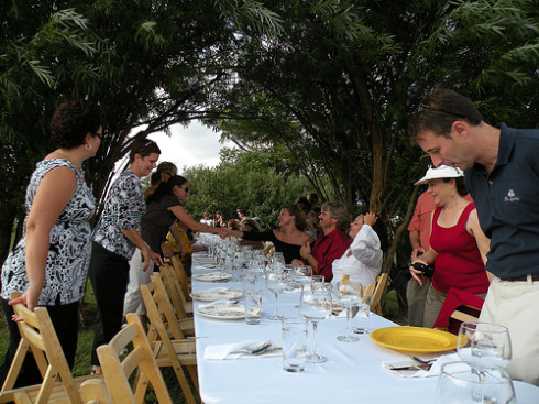 Guests sit down for dinner; introductions are made.