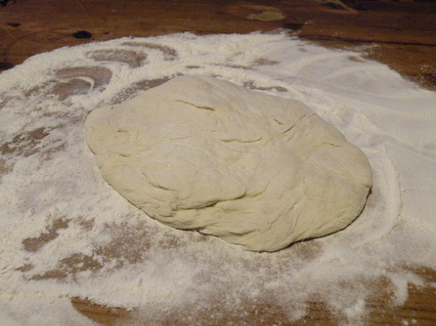 Rolling out the dough to make some flatbread