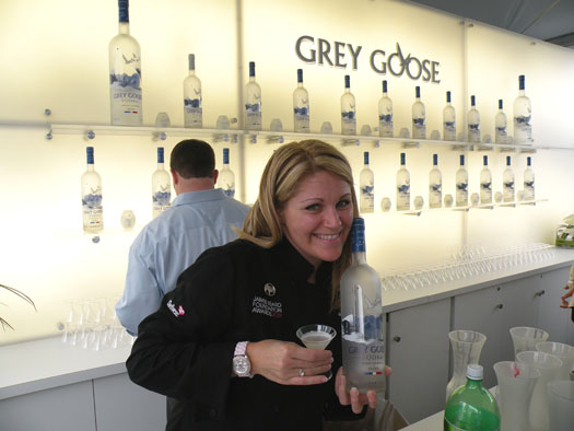 Mixologist Deebi Peek shows off a mini martini made with Grey Goose vodka and a honey rosemary syrup.