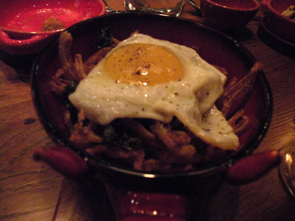Pig\'s ear with crispy kale, marinated cherry peppers and fried egg