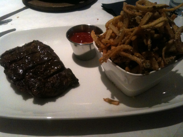 RB Grille\'s steak and fries. The steak was served a perfectly cooked medium rare, while the fries suffered from overseasoning, which made them soggy.