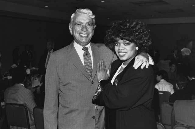 Rising industrial star Sid Port meets rising TV star Oprah Winfrey at a Lawson meeting in the early 80s. (Art Shay)