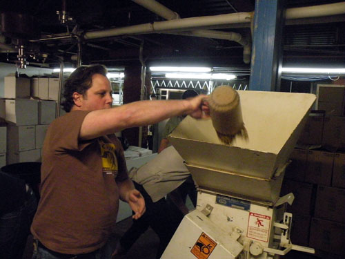 Another shot of Paul Kahan measuring out Pilsner malt for the biere de garde.
