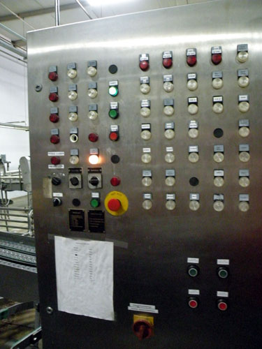 The bottle processing operating board at New Holland\'s brewery, with German instructions.  Haggerty never found out what the red light on the left, fifth row down, is supposed to indicate.  \"Sometimes it just lights up, and it doesn\'t affect anything,\" he said.  So he taped \"TILT!.  Prize When Lit\" around the light.