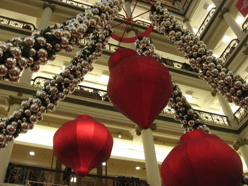 A look up at some of the Macy\'s decorations.  Not visible: Errant husbands contemplating a jump.