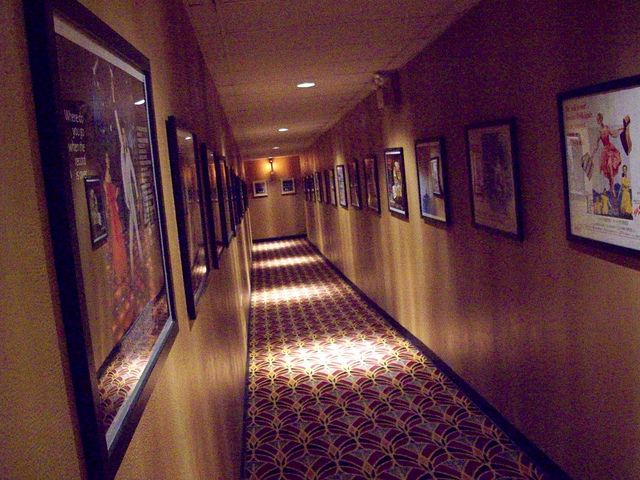 A corridor leading to two of the screens.