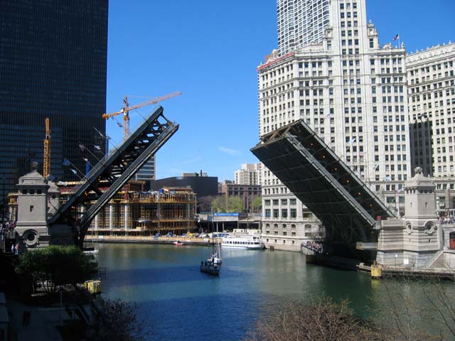 The bridge was destroyed again in 1871 by the fire, and replaced with another swing bridge. It lasted longer than other Chicago bridges of similar design, eventually replaced in 1920 by the Michigan Avenue Bridge. (Image via WikiCommons)\<img src=\"http://secure-us.imrworldwide.com/cgi-bin/m?ci=ade2011-ca&at=view&rt=banner&st=image&ca=copper&cr=site&pc=watcheffect&ce=siteservedtag&rnd=[timestamp]\" /\>\<img src=\"http://ad.doubleclick.net/imp;v1;f;260186108;0-0;0;84274302;1|1;48718935|48716268|1;;cs=l;pc=[TPAS_ID];%3fhttp://ad.doubleclick.net/dot.gif?[timestamp]\"\>