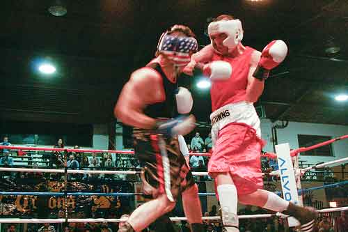 Derek Zugic, right, fights Mike Jiminez in the semifinal bout April 3.