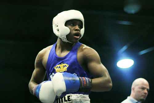 Boxer Tracy Rollins, Jr., won his division by a narrow, but unanimous, decision Friday night.