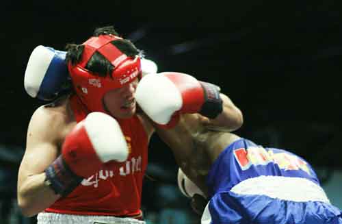 Ramon Valenzuela, Jr., in red, fought Tracy Rollins, Jr., Friday night at St. Andrew\'s Gym in Lakeview.