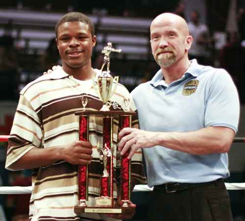 Junior Wright, Jr., with Chicago Golden Gloves chief of officials John O\'Brien. Wright was awarded the tournament\'s Best Boxer award. \r\n