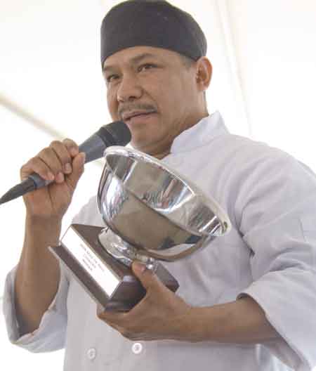 Chef J. Agustin Bahena of Fogata Village accepting his award for best mole sauce at this year\'s Mole de Mayo, the first celebration of its kind in Pilsen.